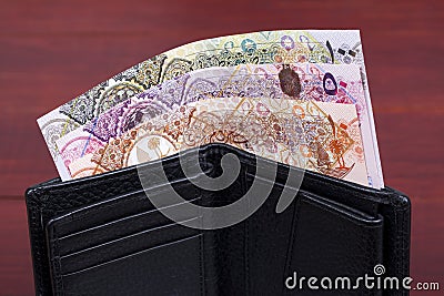 Qatari money in the black wallet Stock Photo