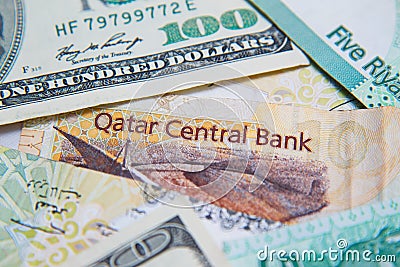 Qatari riyals and American dollars, Stock Photo