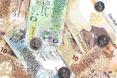 Qatari riyals currency bills and coins as a background Stock Photo