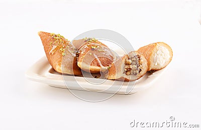 Qatayef Ramadan Traditional Sweets plate on white background Stock Photo