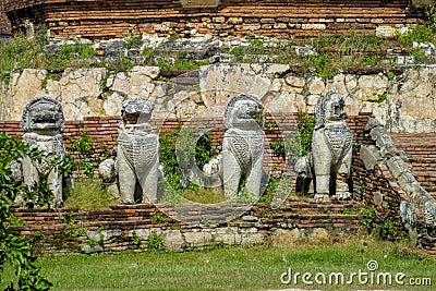 Qilin asian mythological guard statue in ancient Thai temple Stock Photo