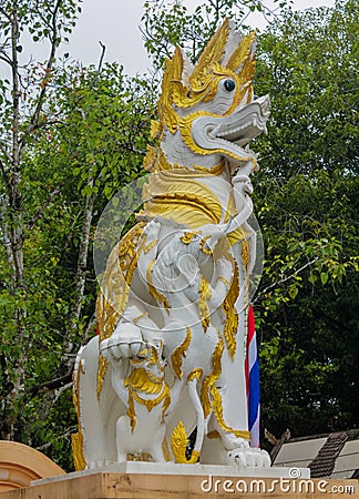 Qilin asian mythological guard white statue in Thai temple Editorial Stock Photo