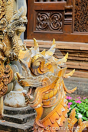 Qilin asian mythological wooden statue in Thailand wat Stock Photo