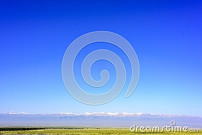 In Qinghai province of China, blue sky, grassland and snow-capped mountains constitute a beautiful picture Stock Photo