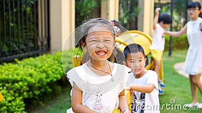 Qingyuan, China - June 23, 2016: Chinese young kids outdoors on the playground Editorial Stock Photo