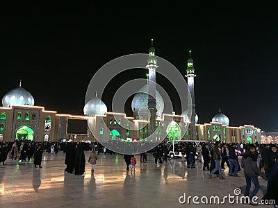 QOM, IRAN - 2018: A large crowd of people walk in the yard of Jamkaran mosque at night. Qom, Iran Editorial Stock Photo