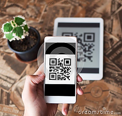 QR code payment transaction using mobile smartphone and tablet devices Stock Photo