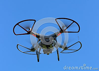 Quad Copter Drone on a blue background Stock Photo