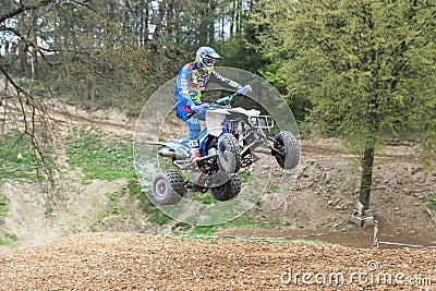 Quad rider is high jumping in the difficult terrain Editorial Stock Photo