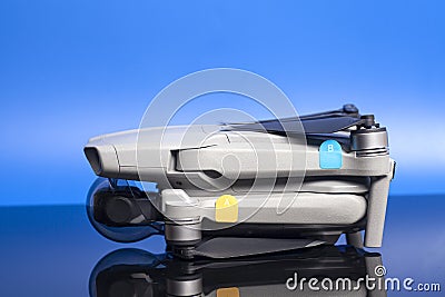 Quadcopter drone aerial camera on blue background Stock Photo