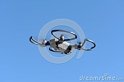 Quadcopter drone, with hight resolution camera, flying in the bl Stock Photo