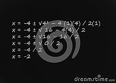 Quadratic Formula written on blackboard Stock Photo