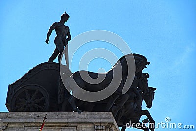 Quadriga statue on the roof of a building in Madrid Editorial Stock Photo