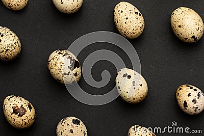 Quail eggs close-up on a black backgroundHoliday easter, minimalistic black composition Stock Photo