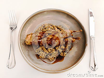 Quail stuffed with porcini mushrooms with game demiglas Stock Photo