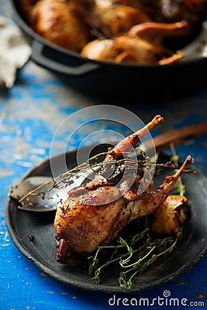 Quail stuffed with porcini mushrooms. Stock Photo