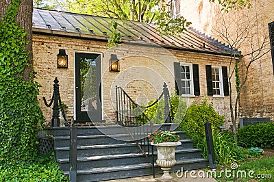 Quaint cabin in woods Stock Photo