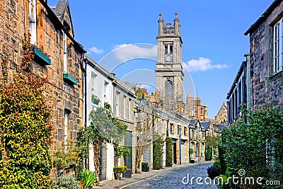 Quaint street with church spire in Edinburgh, Scotland Stock Photo