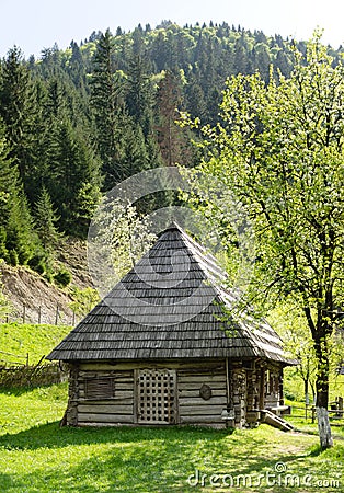 Quaint timber cabin with wooden shingles Stock Photo