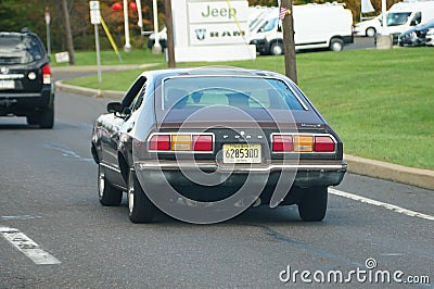 Quakertown, Pennsylvania, U.S.A - October 22, 2023 - A brown color of 1977 Ford Mustang on the road Editorial Stock Photo