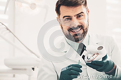 Qualified dentist conducting consultation about appropriate teeth care Stock Photo