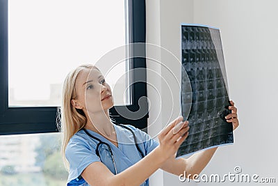 Qualified nurse or physician checking mri scan Stock Photo