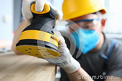 Qualified repairman using tool Stock Photo