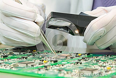 Quality control of electronic components on PCB Stock Photo