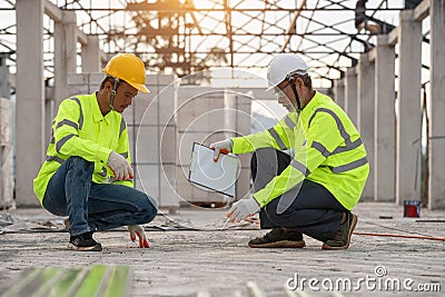 The quality inspection of cement floors by supervisor engineers and workers Stock Photo