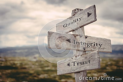 Quality, integrity, trust signpost in nature. Stock Photo