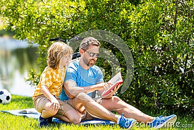 quality time for father and son. Father and son connect through stories in nature. Father and son bonding over outdoor Stock Photo