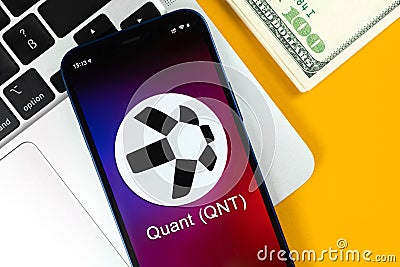 Quant QNT coin symbol. Trade with cryptocurrency, digital and virtual money, banking with mobile phone concept. Business Editorial Stock Photo