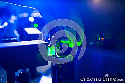 Quantum optics - hand of a researcher adjusting a laser beam Stock Photo