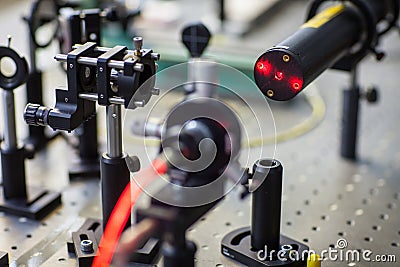 Quantum optics lab installations with laser, irises, appertures Stock Photo