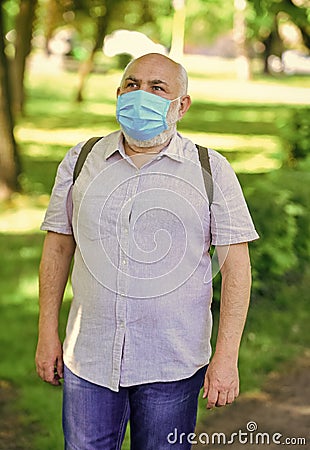 Quarantine extended. Mask protecting from virus. Pandemic concept. Limit risk infection spreading. Senior man face mask Stock Photo