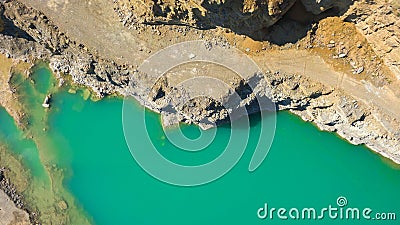 Quarry with beautiful blue water in it. Aerial view from drone Stock Photo