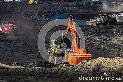 Quarry dumptruck working in a coal mine Editorial Stock Photo