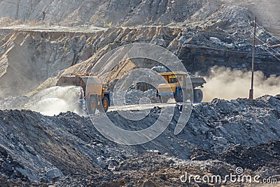 Quarry dumptruck working in a coal mine Stock Photo