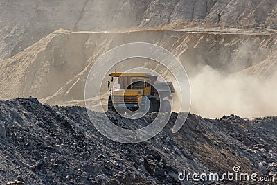 Quarry dumptruck working in a coal mine Stock Photo