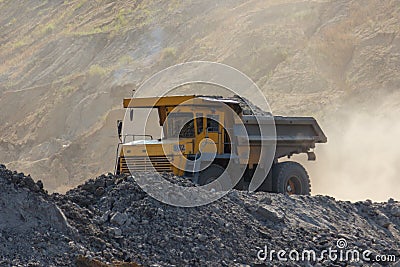 Quarry dumptruck working in a coal mine Stock Photo