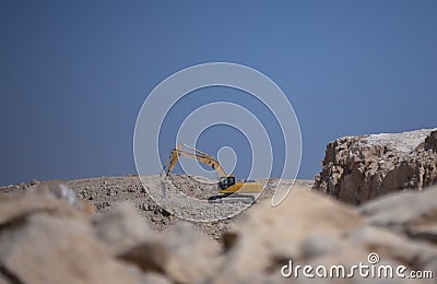 Quarry Mining excavators working on breaking the rocks Editorial Stock Photo