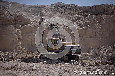 Quarry Mining excavators working on breaking the rocks Editorial Stock Photo