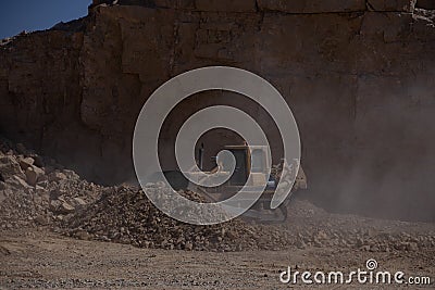 Quarry Mining movers excavators working on breaking the rocks Editorial Stock Photo