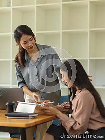 Quarter-length portrait of female senior giving advice to her underling Stock Photo