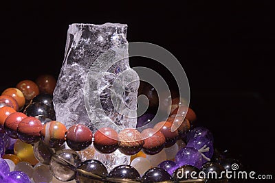 Quartz geode with semiprecious gemstone bracelets charging, spirituality concept, alternative medicine Stock Photo