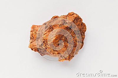 Quartzite ferruginous on white background. Macro photo of mineral rock sample Stock Photo