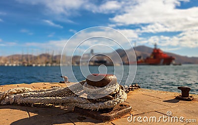 This bollard is in the port of Cartagena. Ships are in the background. Stock Photo