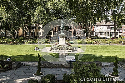 Quebec City 13.09.2017 Bronze statue Sancta Joanna D arc - Joan of Arc war memorial in a colorful garden on a sunny day Editorial Stock Photo