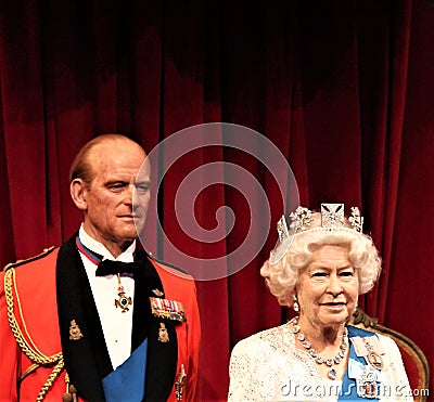 Queen Elizabeth, London, United Kingdom - March 20, 2017: Queen Elizabeth ii & Prince Philip portrait figure at museum, London Editorial Stock Photo