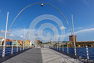 The Queen Emma floating bridge and pastel colored architecture of Curacao island Editorial Stock Photo